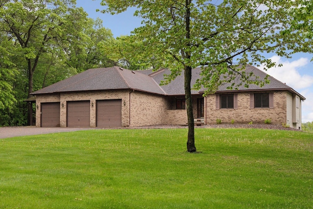 124 166th Ave NE, Andover, MN 55304 - view of front of house featuring an attached garage, a front lawn, brick siding, driveway, and a shingled roof
