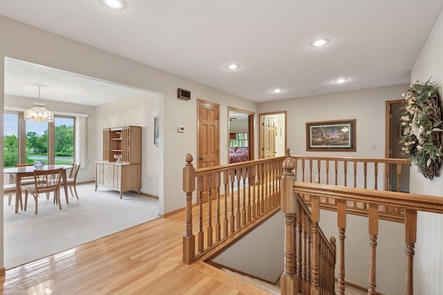 124 166th Ave NE, Andover, MN 55304 - hall with an upstairs landing, a chandelier, recessed lighting, light wood-style floors, and baseboards