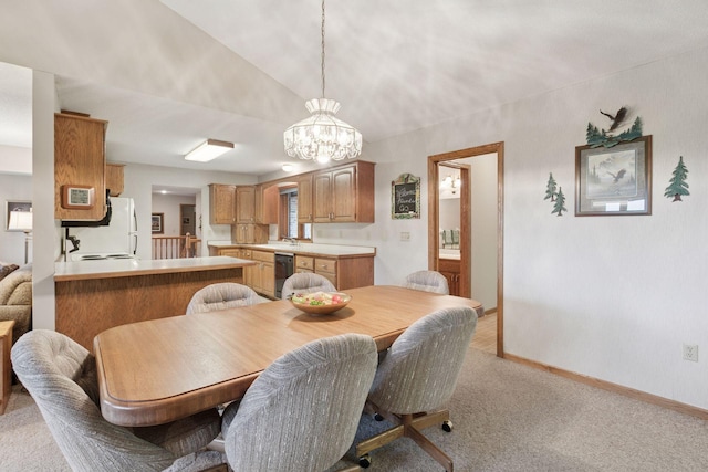 124 166th Ave NE, Andover, MN 55304 - dining area featuring light colored carpet, a chandelier, and baseboards