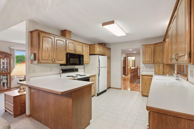 124 166th Ave NE, Andover, MN 55304 - kitchen featuring a sink, black microwave, electric range oven, freestanding refrigerator, and light countertops