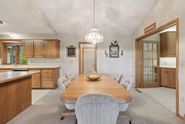 124 166th Ave NE, Andover, MN 55304 - dining area featuring light carpet, a chandelier, and vaulted ceiling