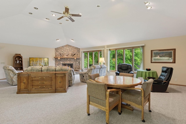 124 166th Ave NE, Andover, MN 55304 - dining space featuring lofted ceiling, light carpet, a ceiling fan, a fireplace, and baseboards