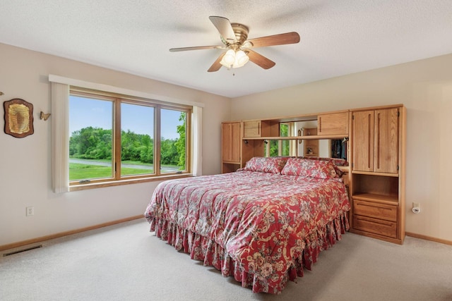 124 166th Ave NE, Andover, MN 55304 - bedroom featuring baseboards, light colored carpet, a ceiling fan, and a textured ceiling