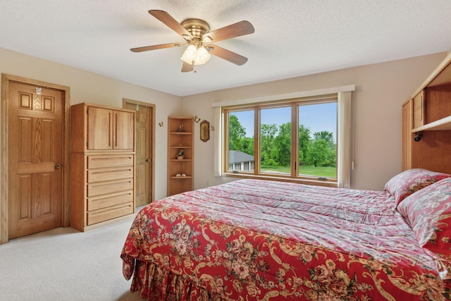 124 166th Ave NE, Andover, MN 55304 - carpeted bedroom featuring ceiling fan and a textured ceiling