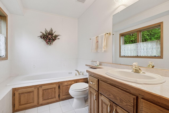 124 166th Ave NE, Andover, MN 55304 - full bathroom featuring toilet, a garden tub, vanity, and tile patterned floors