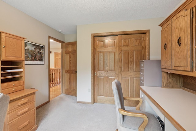 124 166th Ave NE, Andover, MN 55304 - unfurnished office featuring light colored carpet, built in desk, and a textured ceiling