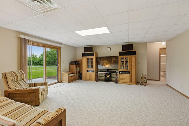 124 166th Ave NE, Andover, MN 55304 - living area featuring light carpet, a drop ceiling, and baseboards