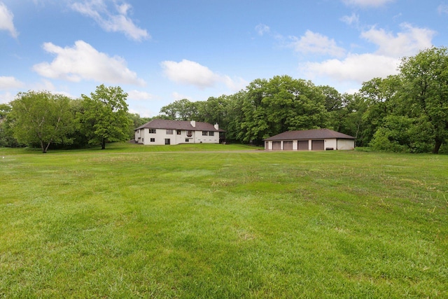 124 166th Ave NE, Andover, MN 55304 - view of green lawn featuring a detached garage and an outdoor structure