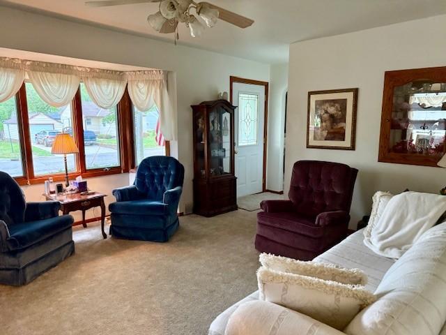 106 Morningside Rd, Albert Lea, MN 56007 - carpeted living room featuring ceiling fan