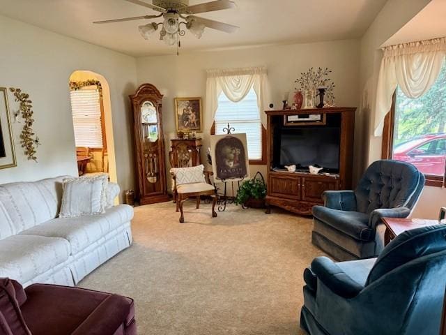 106 Morningside Rd, Albert Lea, MN 56007 - living area featuring carpet flooring, ceiling fan, and arched walkways