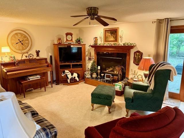106 Morningside Rd, Albert Lea, MN 56007 - living room featuring a ceiling fan, a fireplace, and carpet