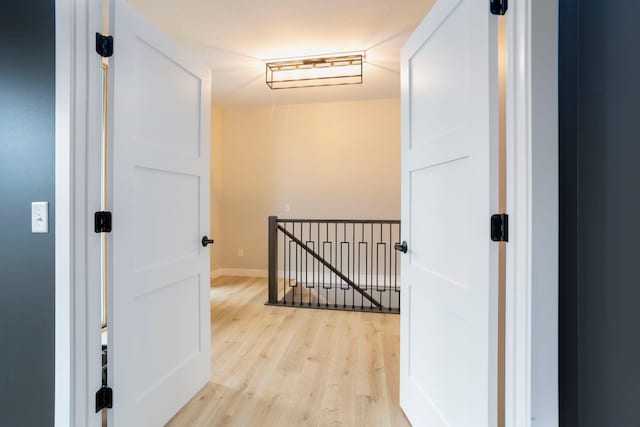415 Moelter Ln, Troy Twp, WI 54016 - corridor with light wood finished floors, an upstairs landing, and baseboards