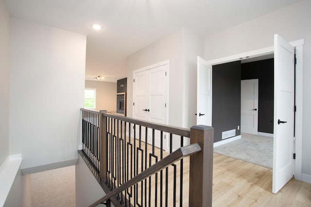 415 Moelter Ln, Troy Twp, WI 54016 - hallway featuring an upstairs landing, light wood-type flooring, and baseboards