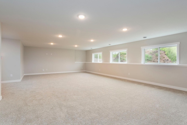 415 Moelter Ln, Troy Twp, WI 54016 - unfurnished room featuring light carpet, recessed lighting, and baseboards
