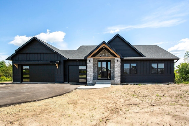 415 Moelter Ln, Troy Twp, WI 54016 - modern farmhouse featuring board and batten siding, a garage, asphalt driveway, and roof with shingles