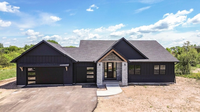 415 Moelter Ln, Troy Twp, WI 54016 - view of front of home featuring board and batten siding and roof with shingles