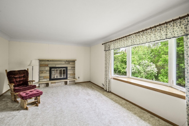 1213 Highview Dr, New Brighton, MN 55112 - sitting room with plenty of natural light, carpet floors, a stone fireplace, and baseboards