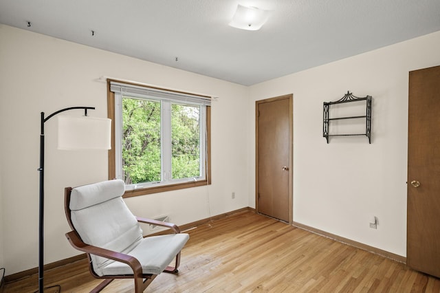 1213 Highview Dr, New Brighton, MN 55112 - sitting room featuring light wood-style flooring and baseboards