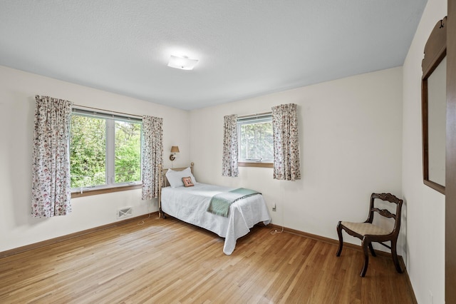1213 Highview Dr, New Brighton, MN 55112 - bedroom with light wood-style floors and baseboards