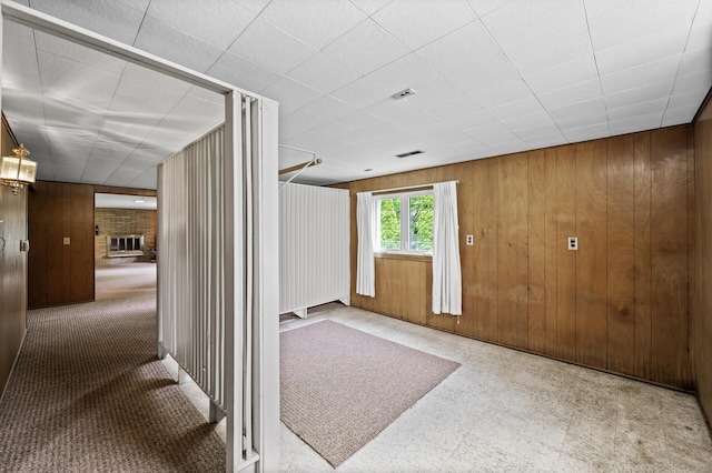 1213 Highview Dr, New Brighton, MN 55112 - entrance foyer with wooden walls and a brick fireplace