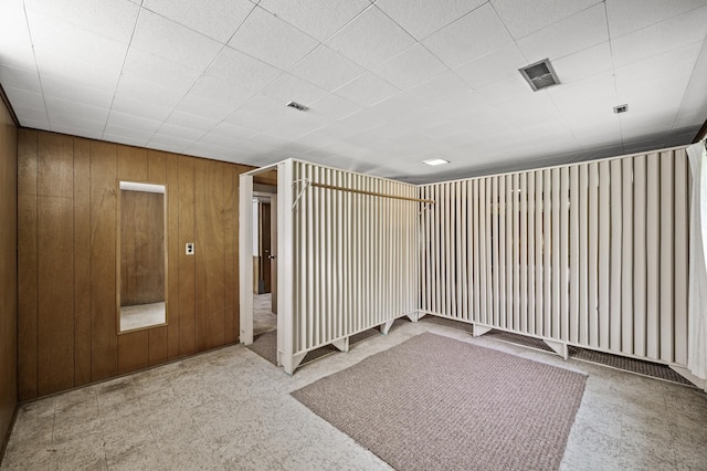1213 Highview Dr, New Brighton, MN 55112 - unfurnished room featuring wood walls and tile patterned floors