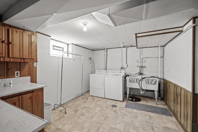 1213 Highview Dr, New Brighton, MN 55112 - laundry area with washer and dryer and wood walls