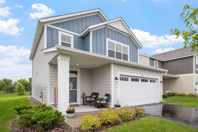 8857 152nd Ln NW, Ramsey, MN 55303 - traditional-style house featuring board and batten siding, a garage, asphalt driveway, and a front yard