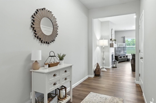 8857 152nd Ln NW, Ramsey, MN 55303 - hallway featuring wood finished floors and baseboards