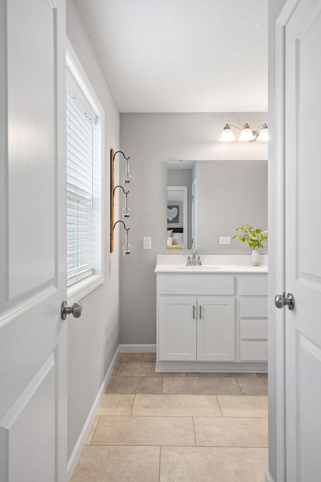 8857 152nd Ln NW, Ramsey, MN 55303 - bathroom featuring vanity and tile patterned flooring