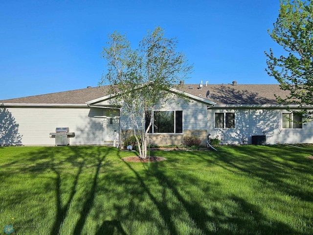 639 2nd St NW, Dilworth, MN 56529 - back of property featuring a lawn and cooling unit