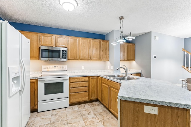 10938 181st Ln NW, Elk River, MN 55330 - kitchen featuring white appliances, a peninsula, a sink, a textured ceiling, and light countertops
