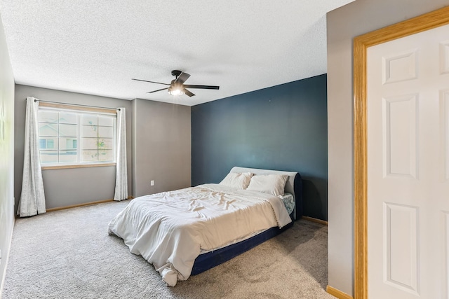 10938 181st Ln NW, Elk River, MN 55330 - bedroom featuring carpet, baseboards, a textured ceiling, and a ceiling fan