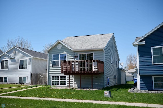 view of front of house featuring a front yard and a deck