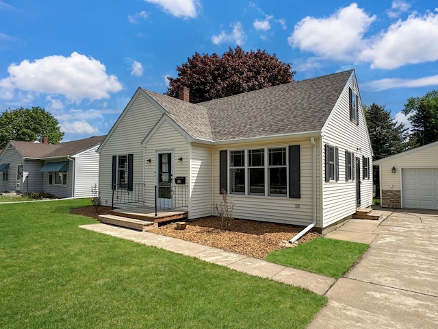 550 Center St, Tracy, MN 56175 - view of front of house with an outdoor structure, a front lawn, a shingled roof, and driveway