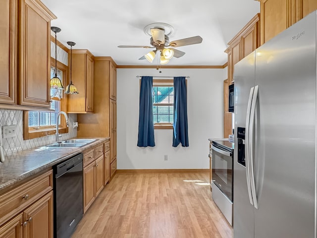 550 Center St, Tracy, MN 56175 - kitchen with black appliances, a sink, light wood-style floors, a ceiling fan, and backsplash