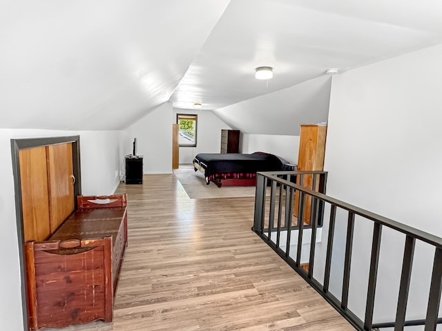 550 Center St, Tracy, MN 56175 - bedroom with light wood-style flooring and vaulted ceiling