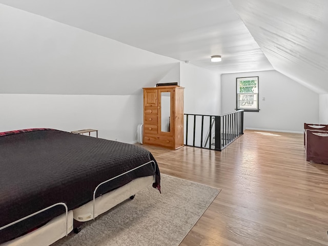 550 Center St, Tracy, MN 56175 - bedroom with vaulted ceiling, light wood-style floors, and baseboards