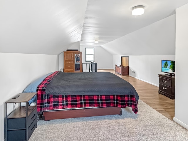 550 Center St, Tracy, MN 56175 - bedroom featuring wood finished floors, baseboards, and lofted ceiling