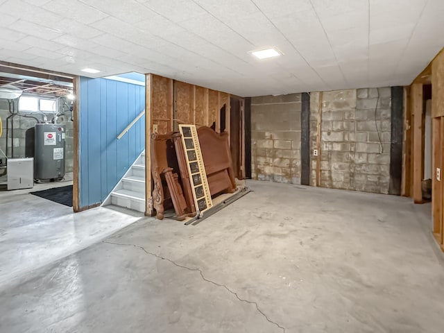 550 Center St, Tracy, MN 56175 - basement featuring electric water heater and stairway