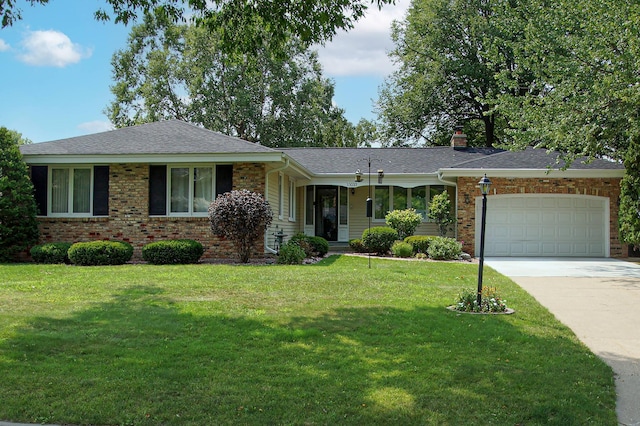 ranch-style house with concrete driveway, an attached garage, a front lawn, and brick siding
