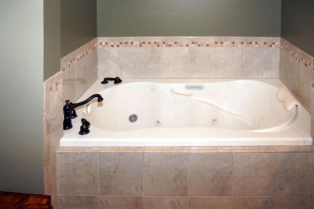 full bathroom featuring a jetted tub