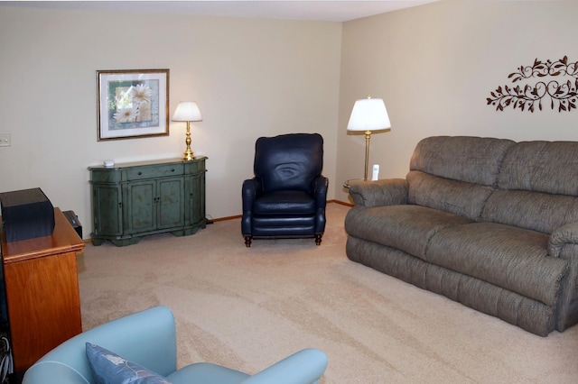 living room featuring carpet and baseboards