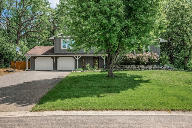 7712 Bester Ave, Inver Grove Heights, MN 55076 - obstructed view of property with driveway and a garage