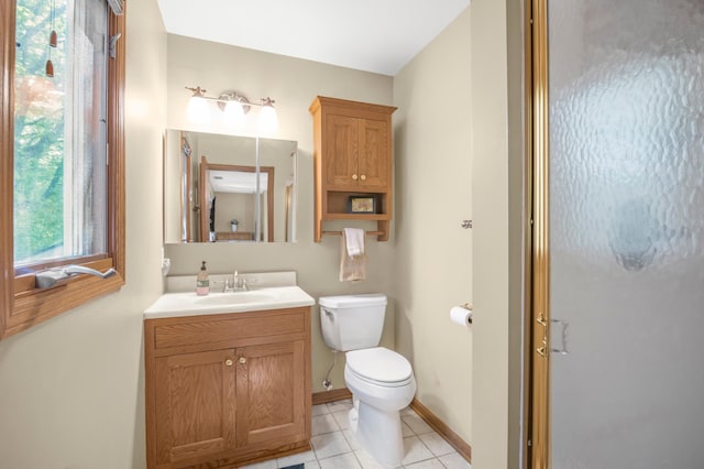 7712 Bester Ave, Inver Grove Heights, MN 55076 - bathroom with vanity, toilet, tile patterned flooring, and baseboards