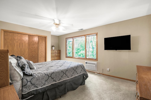 7712 Bester Ave, Inver Grove Heights, MN 55076 - carpeted bedroom with a wall mounted AC, baseboards, a closet, and a ceiling fan