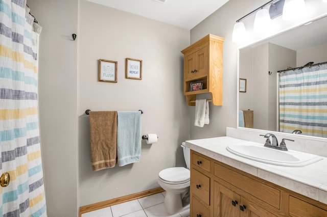 7712 Bester Ave, Inver Grove Heights, MN 55076 - bathroom with toilet, vanity, tile patterned floors, baseboards, and curtained shower