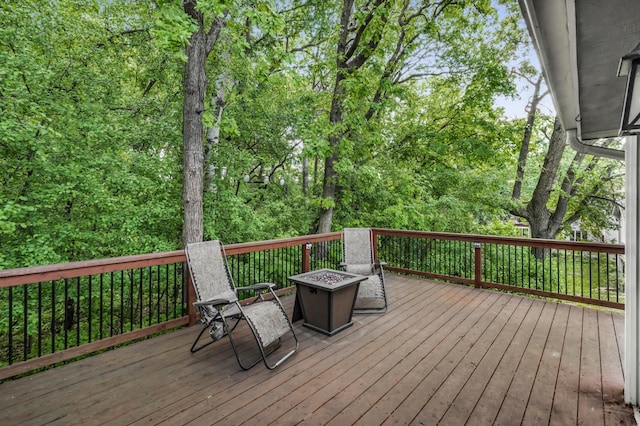 7712 Bester Ave, Inver Grove Heights, MN 55076 - wooden terrace with an outdoor fire pit