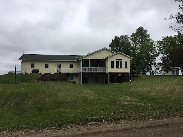 39937 Buchanan St NE, Stanchfield Twp, MN 55080 - rear view of property featuring a sunroom and a lawn