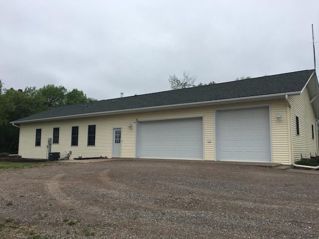 39937 Buchanan St NE, Stanchfield Twp, MN 55080 - garage featuring asphalt driveway and central AC