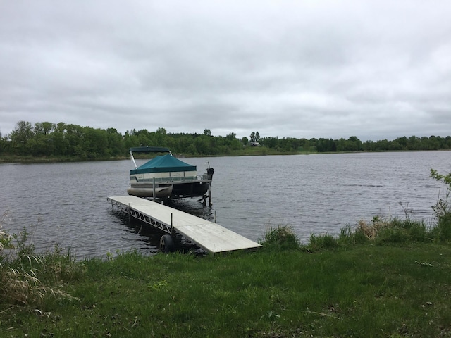 39937 Buchanan St NE, Stanchfield Twp, MN 55080 - dock with a water view and a forest view